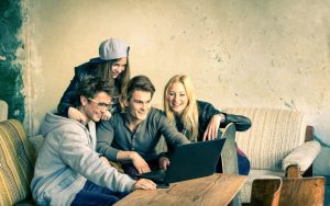 Group of young hipster best friends with computer laptop