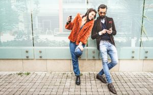 Young Man and Woman with Mobile phones