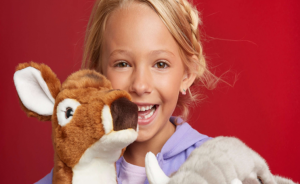 Cute Little girl with Reindeer Stuffed Animal