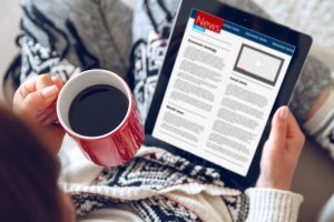 reading news online with coffee digital advertising