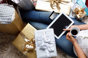 holiday planning and shopping, gift bags and tablet