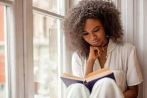 woman reading a book recommendation summer reading