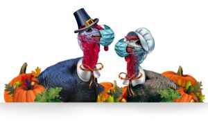 two thanksgiving turkeys with masks on