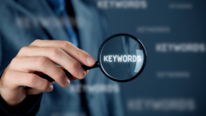 photo of man holding magnifying glass over keywords Keyword cookieless contextual targeting bidtellect